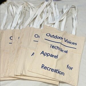 Outdoor Voices Cream Tote with Blue Text